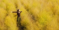 12883-girl-yellow-field-arms-raised-grass-wheat_1200w_tn